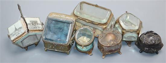 Five assorted 19th century and late gilt metal mounted glass panelled boxes/caskets and two other metal boxes.